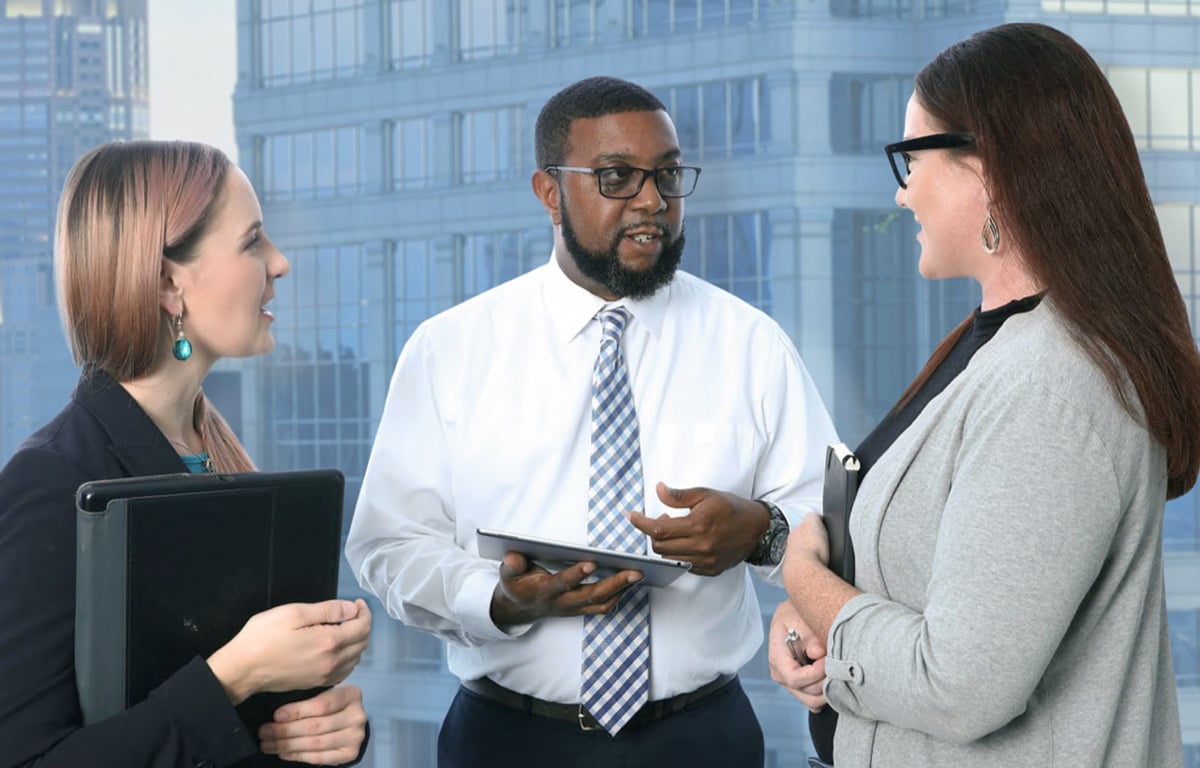 DOTSecurity expert talking to female clients